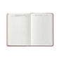 The Graphic Image 2026 Weekly Journal Planner Collection features an open leather notebook with blank pages for dates, addresses, and notes—ideal as a stylish planner for hotel and restaurant records.