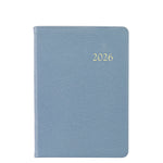 The Graphic Image 2026 Weekly Journal Planner Collection features a light blue leather cover with "2026" embossed in gold and includes convenient appointment pages to keep you organized.