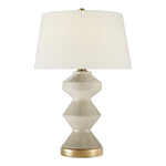 The Weller Zig Zag Lamp in Coconut Porcelain by Visual Comfort features a geometric ceramic base in light beige with gold accents and a subtle pattern, topped with a large white fabric shade for soft light diffusion.
