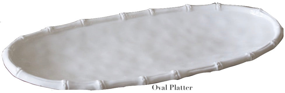 The Vida White Bamboo Serveware Collection by Beatriz Ball features a white, oval ceramic platter with a textured rim—ideal for daily use or special occasions.