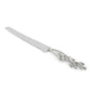 A silver serrated knife from Michael Aram’s White Orchid Serveware Collection, featuring a decorative handle with a floral and branch motif that evokes purity and quiet mystery.