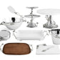 The Michael Aram White Orchid Serveware Collection features metal, wood, and ceramic serving pieces with metallic branch and leaf accents, beautifully arranged on a pure white background.