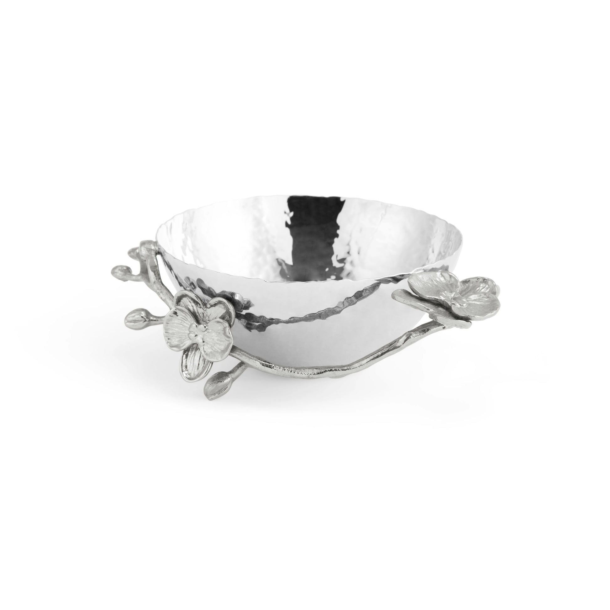 A hammered metal bowl from Michael Aram's White Orchid Serveware Collection, featuring decorative flower and branch accents on the rim for an elegant, mysterious touch.