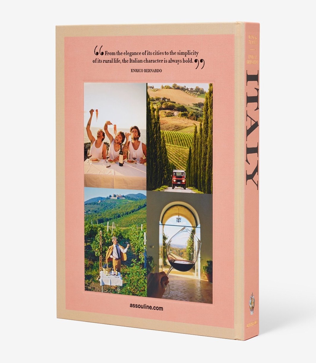 Back cover of the book "Wine & Travel Italy" by Assouline, showcasing four captivating photos: people enjoying a meal, a picturesque Italian road bordered by cypress trees, a verdant vineyard vista, and a woman unwinding in a hammock. A quote from Enrico Bernardo invites readers to delve into the enchanting world of wine tourism.