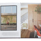 Open book displaying an elegant kitchen with a patterned backsplash on the left page, and a dining area featuring red chairs and wood accents on the right page—capturing the vibrant maximalist decor featured in *Wonderland Adventures in Decorating* by Rizzoli.