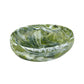 The Nashi Home Serveware Collection, Forest, features a small glossy oval resinware bowl with an elegant green and white marbled pattern by Nashi Home, perfect for elevating your home decor. Shown against a white background.