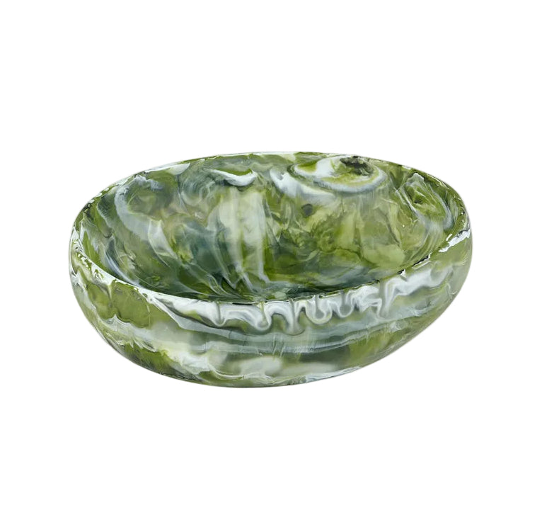 The Nashi Home Serveware Collection, Forest, features a small glossy oval resinware bowl with an elegant green and white marbled pattern by Nashi Home, perfect for elevating your home decor. Shown against a white background.