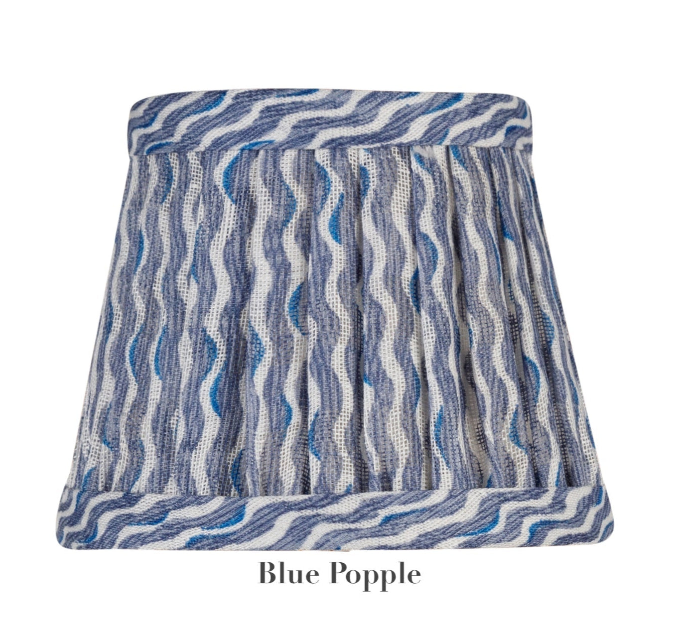 The Zafferano x Fermoie Poldina Lampshade Collection by Zafferano America features a blue and white striped lampshade with a wavy pattern on a white background, with "Blue Popple" text highlighting the Fermoie design style.