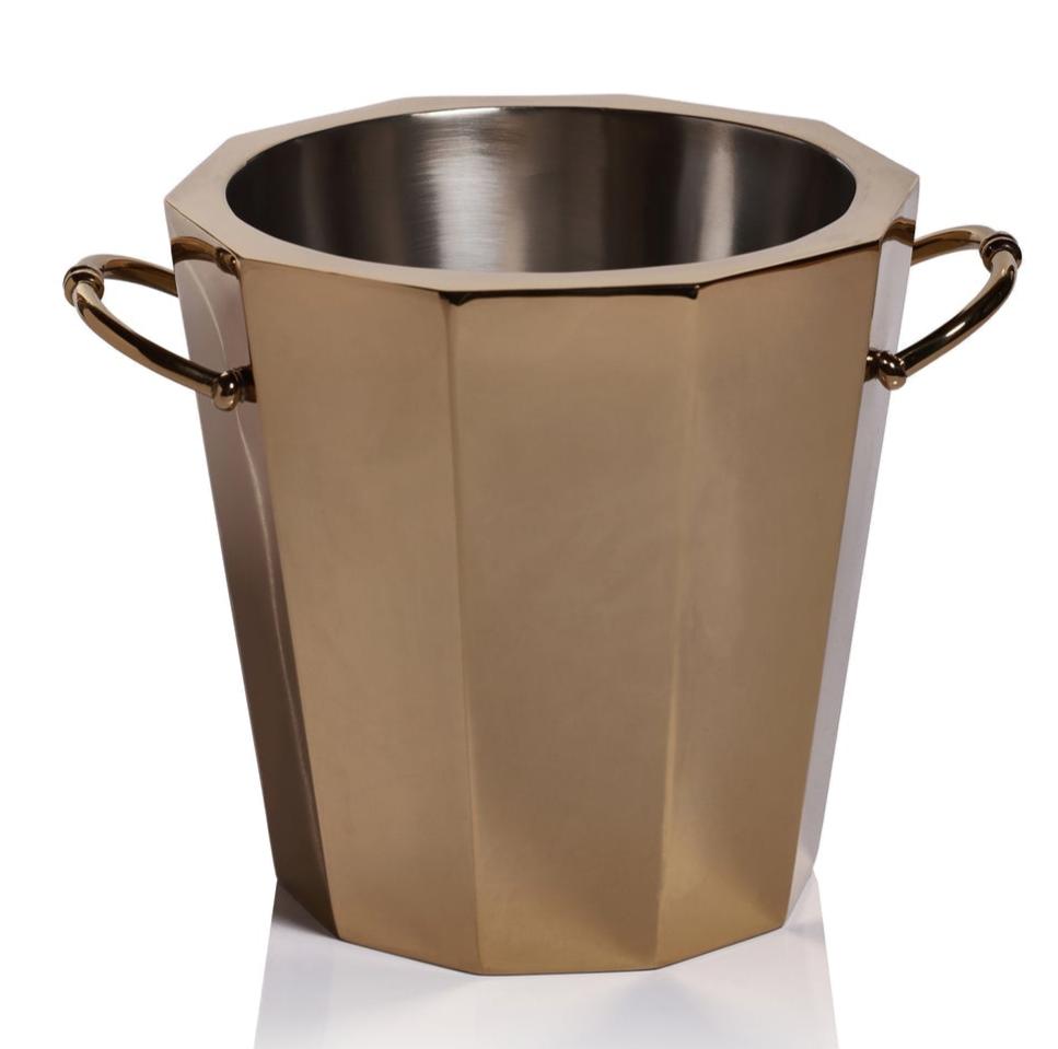The Zodax Alessia Gold Double Wall Ice Bucket features a gold-colored, faceted exterior, two side handles, and a stainless steel interior, displayed against a white background.