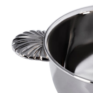 Close-up of the Zodax Eden Roc Condiment Bowl in Polished Nickel, a luxury serving bowl with a textured decorative handle, set against a white background.