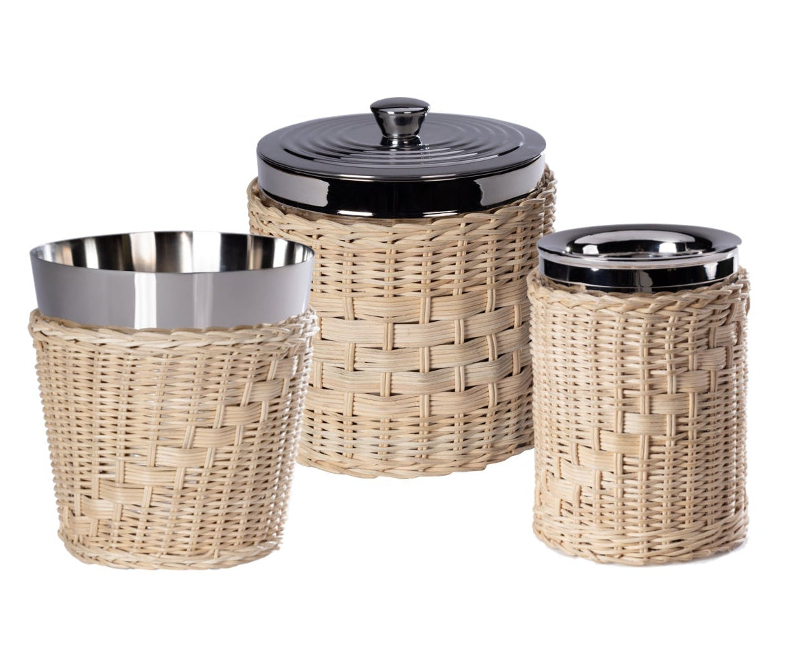 Three kitchen canisters from the Zodax Palmier Barware Collection, featuring stainless steel interiors, black lids, and hand-woven rattan exteriors, bring elegant charm to your bar cart or countertop.