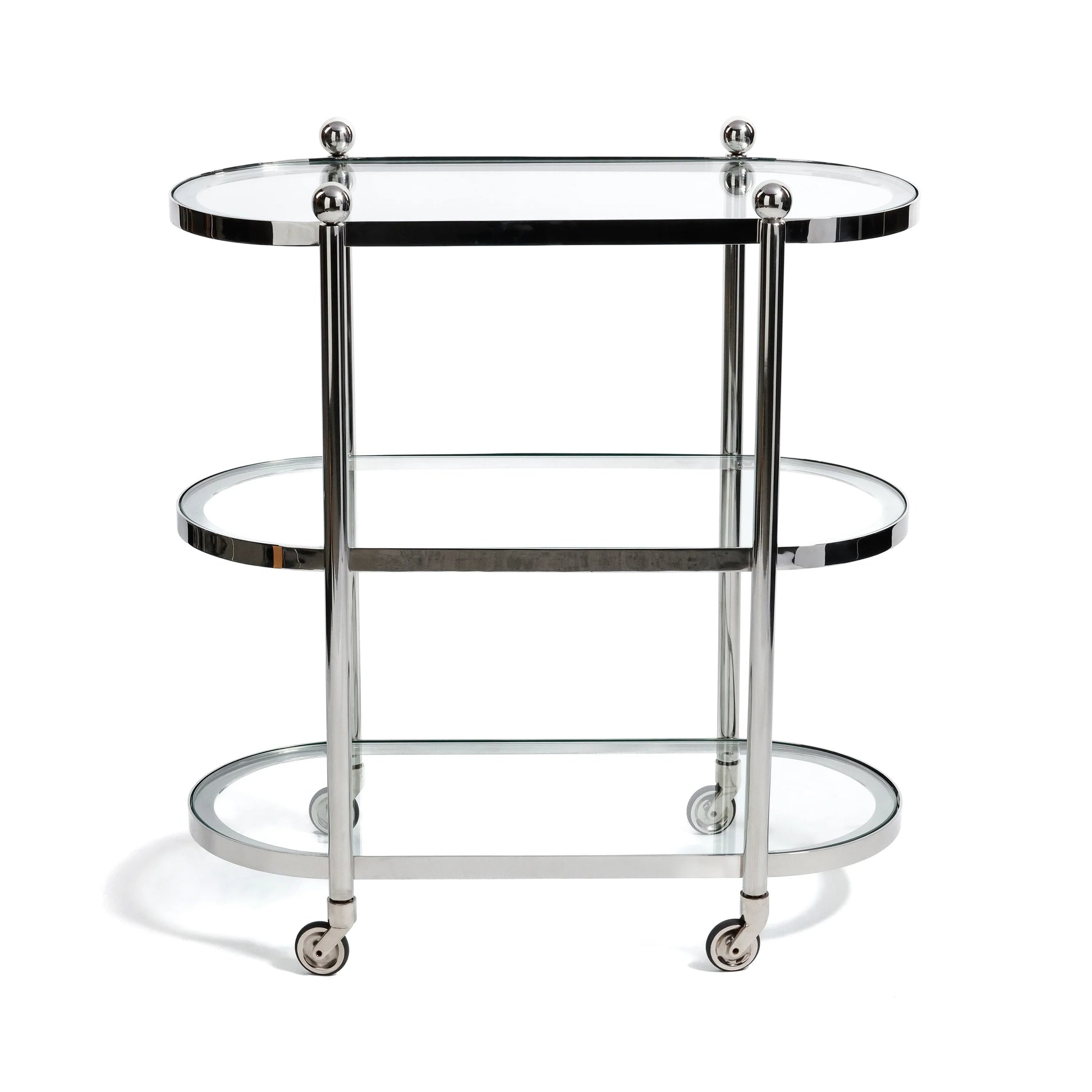The Zodax Oval Round Bar Cart Trolley features three glass tiers, chrome accents, rounded edges, and four swivel caster wheels, offering ample space for bar accessories in a sleek mobile design.