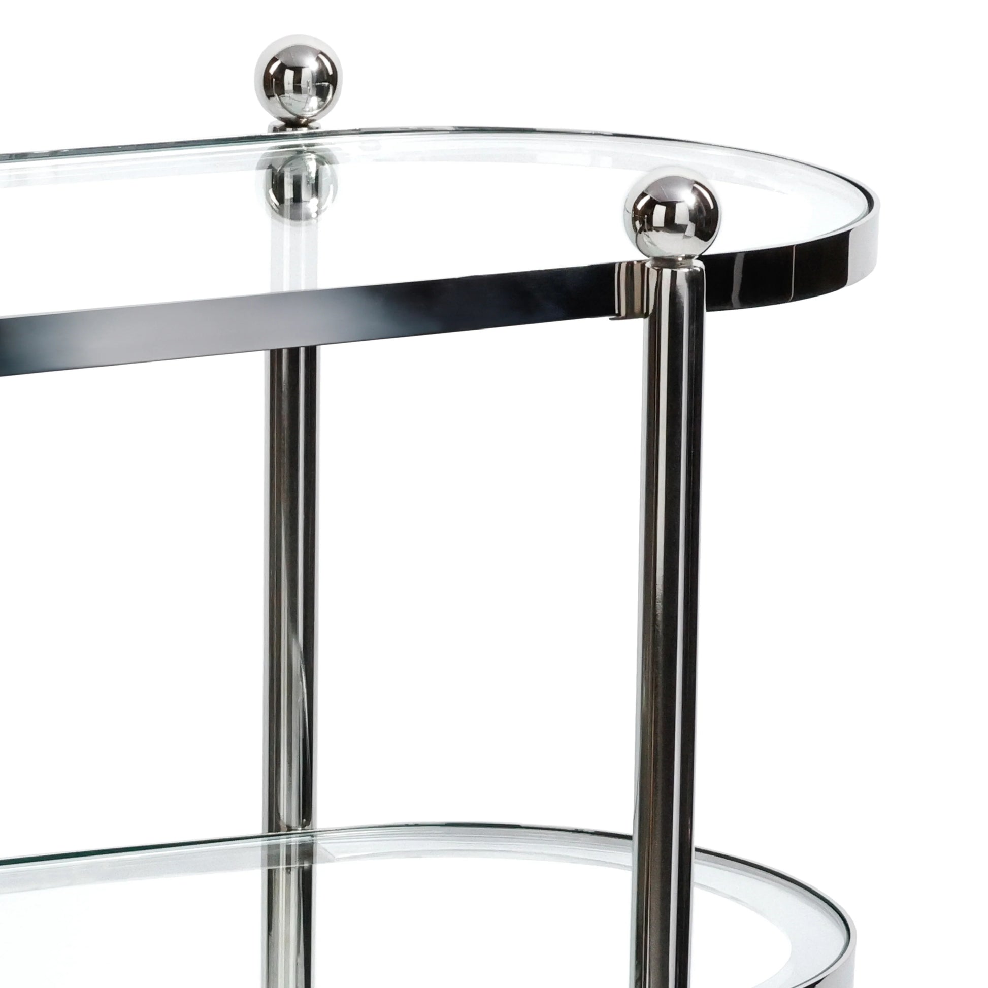 The Zodax Oval Round Bar Cart Trolley features a modern glass and chrome design with rounded edges, two shelves, and spherical metal accents—ideal for showcasing your favorite bar accessories.