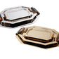 The Zodax Octagon Metal Tray with Horn Handle Collection includes two trays—one polished gold, the other silver—each with bold dark brown horn handles, shown against a white background.