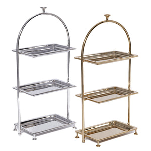 The Zodax High Tea 3-Tier Stand Collection features silver and gold stands with rectangular trays and arched frames, ideal for elegant afternoon tea service or displaying pastries in style.