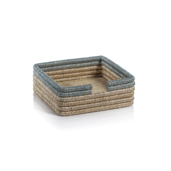 The Zodax La Côte Coiled Napkin Holder features tan woven sides and a blue-grey rim, adding elegant table decor to any setting, shown here against a plain white background.