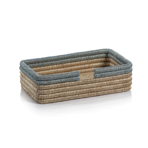 The Zodax La Côte Coiled Napkin Holder Collection features a rectangular rattan holder with tan sides and blue-gray trim—an elegant table decor accent for any setting.