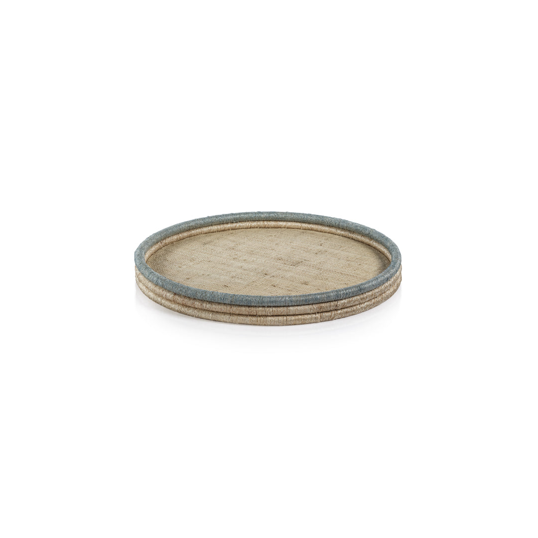 The La Côte Coiled Round Tray Collection by Zodax features a round rattan serving tray in beige and blue tones, ideal for coastal décor, shown on a white background.