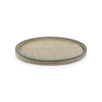 The La Côte Coiled Round Tray Collection by Zodax features a light rattan serving tray with a blue-gray rim, ideal for coastal décor. Shown on a white background.
