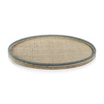 The La Côte Coiled Round Tray Collection by Zodax features a round rattan tray with a beige woven surface and light blue-trimmed raised edge—ideal for adding a coastal touch to your décor.