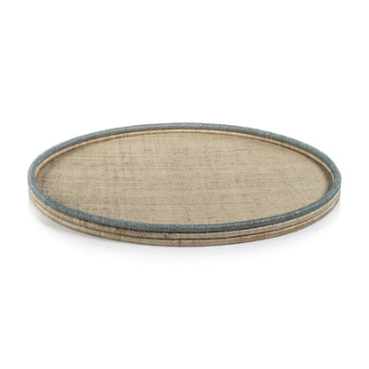 The La Côte Coiled Round Tray Collection by Zodax features a round rattan tray with a beige woven surface and light blue-trimmed raised edge—ideal for adding a coastal touch to your décor.