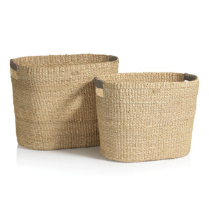 Two Miramar Oval Abaca Baskets by Zodax, crafted from sustainable fibers, are placed side by side with the smaller basket set slightly in front of the larger one.