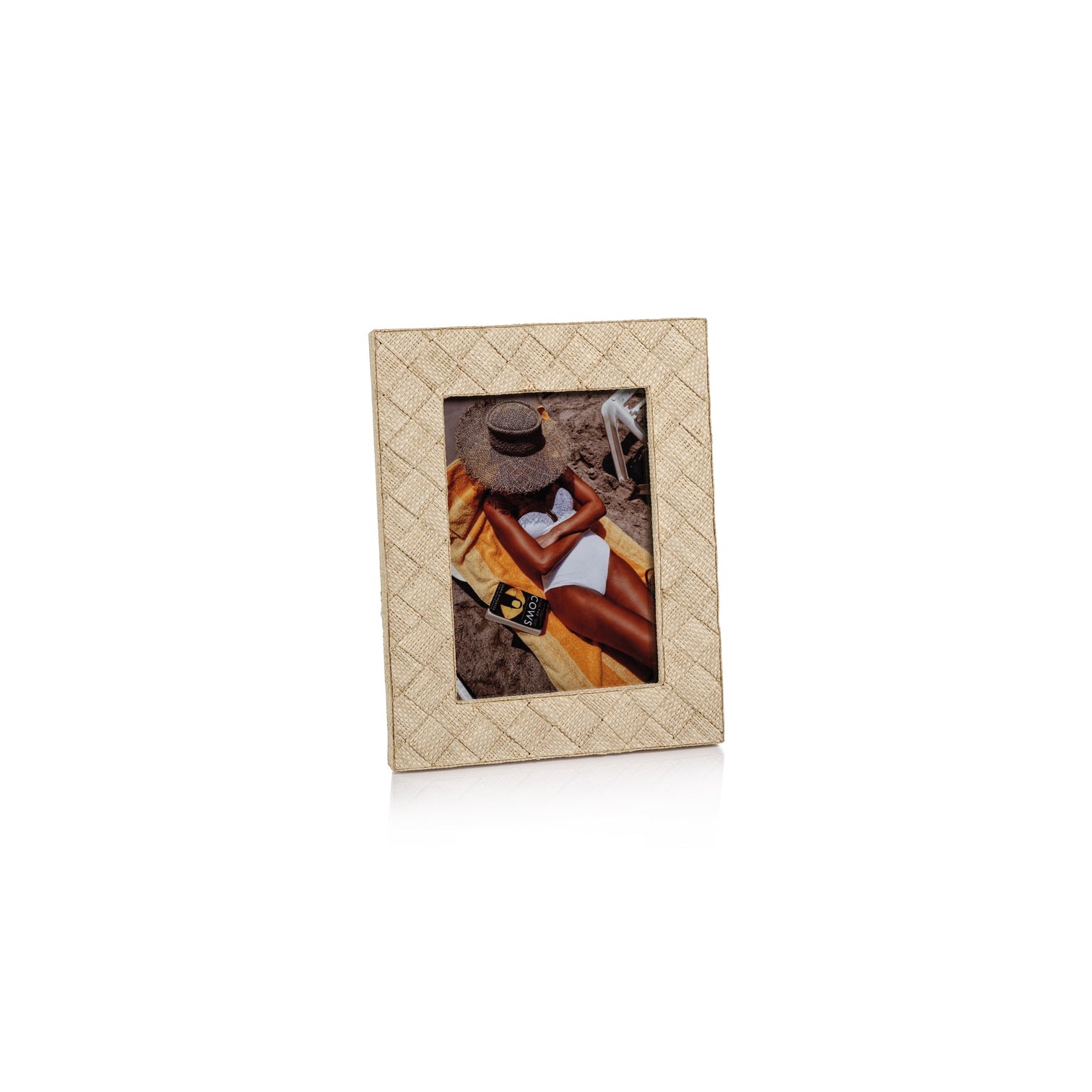 The La Bocca Frame Collection by Zodax features a beige, textured frame crafted from woven raffia, perfect for displaying your favorite moments and adding a natural, chic touch to your decor.