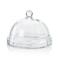 Showcase pastries elegantly with the Zodax Loulou Optic Pastry Glass Plate with Cloche—a clear glass dome featuring a round handle atop a flat plate, ideal for stylish presentation against a white background.