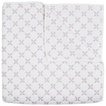 The John Robshaw Layla Lavender Coverlet is a white cotton voile quilt featuring intersecting lavender circles and floral motifs inspired by Mughal gardens, shown neatly folded with one corner turned down.