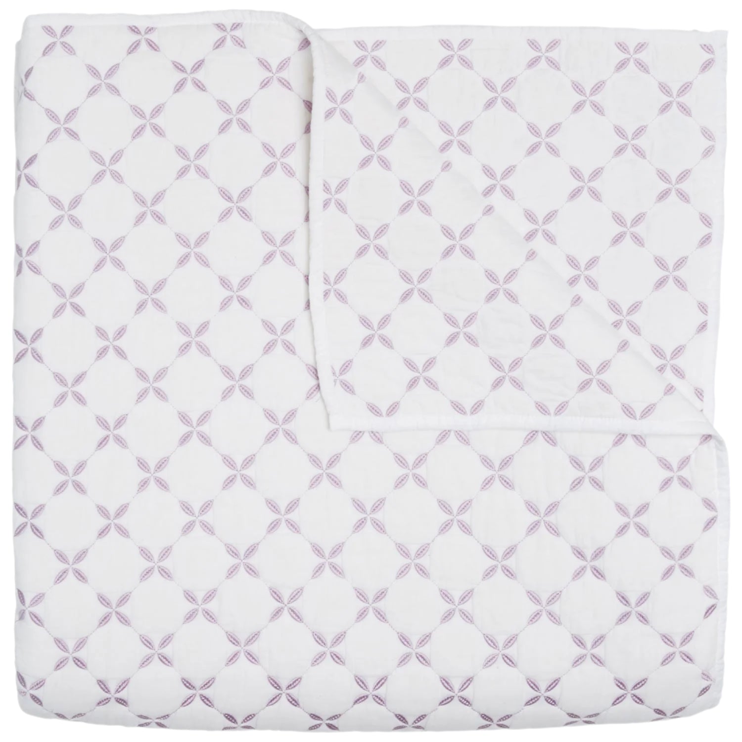 The John Robshaw Layla Lavender Coverlet is a white cotton voile quilt featuring intersecting lavender circles and floral motifs inspired by Mughal gardens, shown neatly folded with one corner turned down.