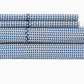 A neatly folded sheet set from the John Robshaw Cinde Bedding Collection in Light Indigo and white, displaying a repeating leaf-like Cinde print, including two pillowcases, a flat sheet, and a fitted sheet, stacked on a white background.