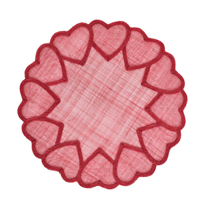 The Heart Placemat Collection by Juliska features a round red mesh abaca placemat with embroidered hearts spaced around the border.