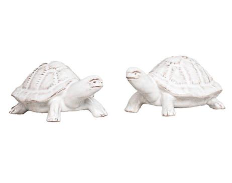 The Clever Creatures Turtle Salt and Pepper Set by Juliska features two white ceramic turtles with textured shells, positioned side by side and believed to bring wisdom and good luck—an ideal accent for entertaining enthusiasts.