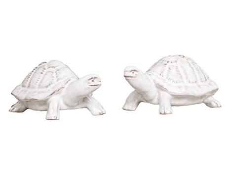 The Juliska Clever Creatures Turtle Salt and Pepper Set features two white ceramic turtles, symbols of wisdom and luck, facing slightly towards each other on a white background.