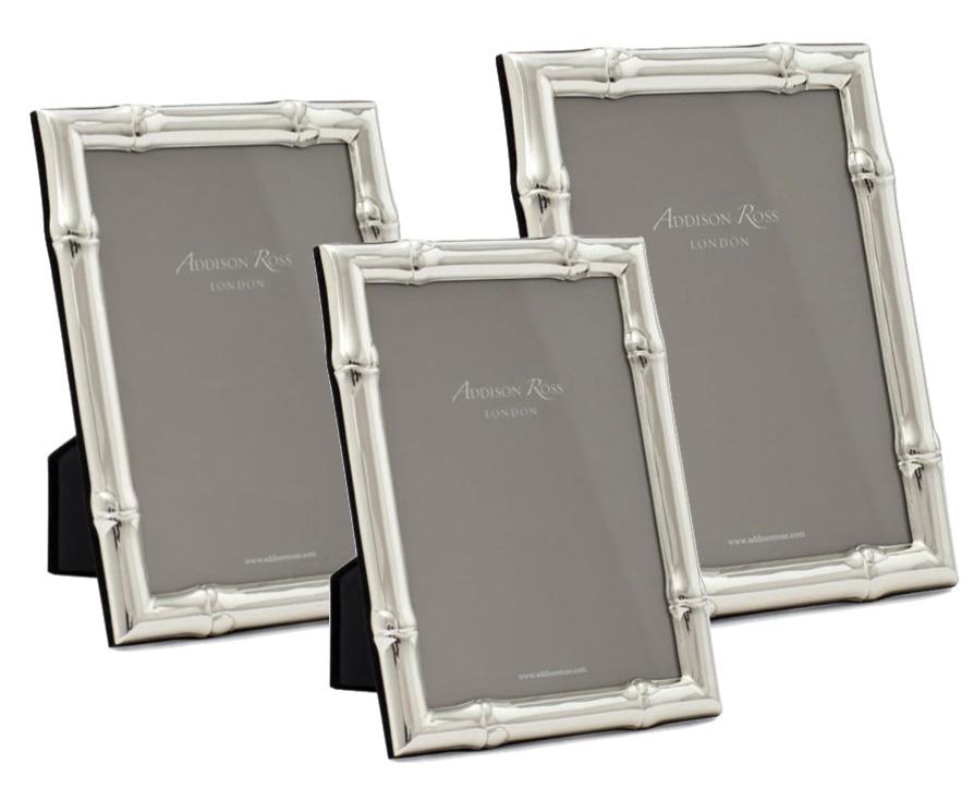 Three silver plated frames from the Addison Ross Wide Bamboo Silver Plated Frame Collection stand upright on flexible easels, each displaying a branded "Addison Ross" insert.