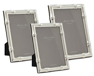 A collection of three Addison Ross Wide Bamboo Silver Plated Photo Frames, varying in size and featuring bamboo-style borders, elegantly displayed on a white background—perfect for sophisticated home decor.