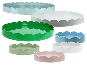 The Addison Ross Round Scalloped Lacquer Tray Collection features glossy trays in green, white, blue, pink, and light green, arranged in various sizes against a white background.