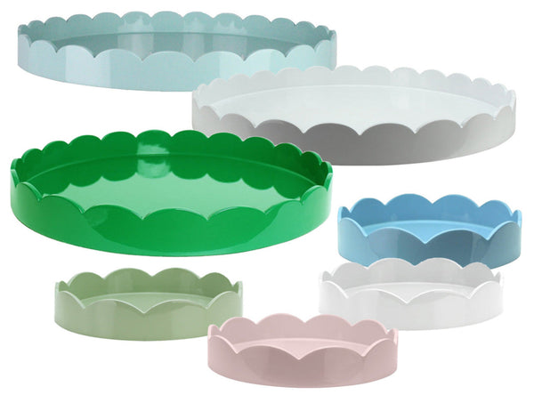 Explore the Addison Ross Round Scalloped Lacquer Tray Collection. These decorative trays come in various sizes and pastel colors, featuring elegant scalloped edges and a glossy finish, perfect as chic drinks trays at gatherings.