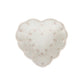The Juliska Berry & Thread Whitewash Heart Serveware Collection features a white, heart-shaped platter with a ruffled rim and dotted pattern, ideal for elegant displays.