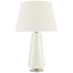 The Penelope Table Lamp Collection by Visual Comfort showcases a white ceramic base, simple white shade, and metallic accents for a modern touch and soft ambient lighting in any space.