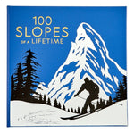 100 Slopes of A Lifetime" by Graphic Image features a skier silhouette amid snowy mountains and pines in blue and white—a gorgeous tribute to must-see ski destinations for your ultimate bucket list.