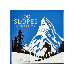 100 Slopes of A Lifetime" by Graphic Image features a skier silhouette amid snowy mountains and pines in blue and white—a gorgeous tribute to must-see ski destinations for your ultimate bucket list.