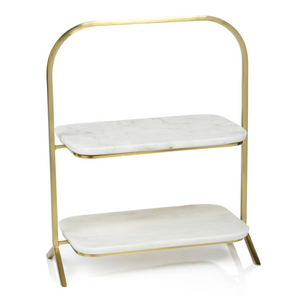 The Zodax Madeleine Marble Two-Tier Stand features a gold metal frame, white marble shelves with rounded edges, and a minimalist design—an elegant choice for stylish entertaining.