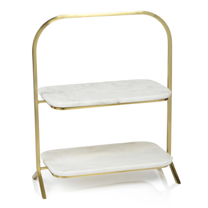 The Zodax Madeleine Marble Two-Tier Stand features a gold metal frame, white marble shelves with rounded edges, and a minimalist design—an elegant choice for stylish entertaining.