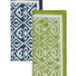 The Kim Seybert Alfresco Napkin Set features two folded cotton napkins with blue and white, and green and white geometric patterns—perfect for any table setting and inspired by traditional block printing.