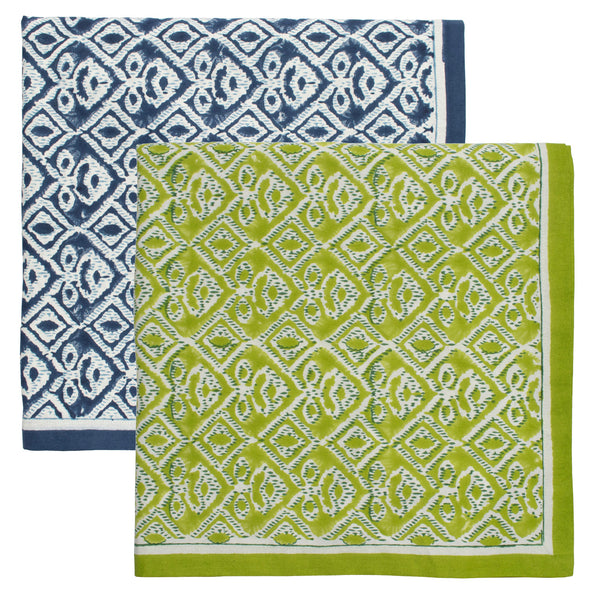 Two geometric-patterned cloths from Kim Seybert, crafted with 100% cotton using Indian block printing: one blue with white, and the other green with white. Ideal for outdoor dining as an alfresco tablecloth.