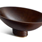The L'Objet Alhambra Bowl Collection features a dark smoked ash bowl with a wide, shallow silhouette and round, tiered base, shown here as an eye-catching decorative accent against a white background.