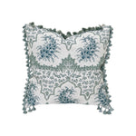 The Alhambra Pillow by Hive Custom Pillows features blue floral designs on a white background with green tassels—an elegant, decorative square pillow perfect for adding a unique, luxurious touch to your decor.