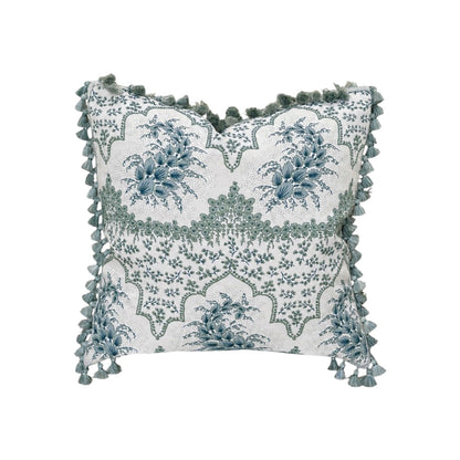 The Alhambra Pillow by Hive Custom Pillows features blue floral designs on a white background with green tassels—an elegant, decorative square pillow perfect for adding a unique, luxurious touch to your decor.