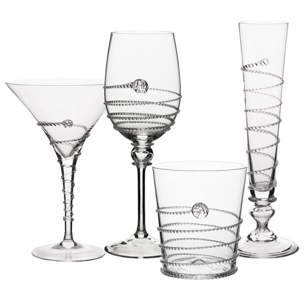 Four elegant Juliska Amalia Glass Collection pieces with ornate designs: a martini glass, a wine glass, a highball glass, and a champagne flute.